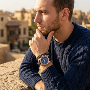 Elegant man wearing Maserati Circuito R8871627002 men's quartz battery watch with rose gold case and luxury blue dial