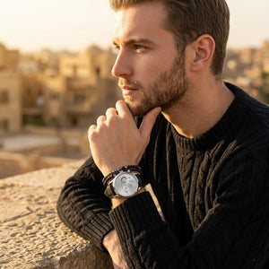 Elegant man wearing Maserati Ricordo R8871633001 men's quartz battery watch with silver case and luxury silver dial