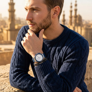 Elegant man wearing Maserati Triconic R8871639001 men's quartz battery watch with grey matte case and luxury blue rubber strap