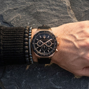 Close up of Maserati Stile Chronograph R8871642001 men's quartz battery watch on wrist showing black dial and luxury rose gold accents
