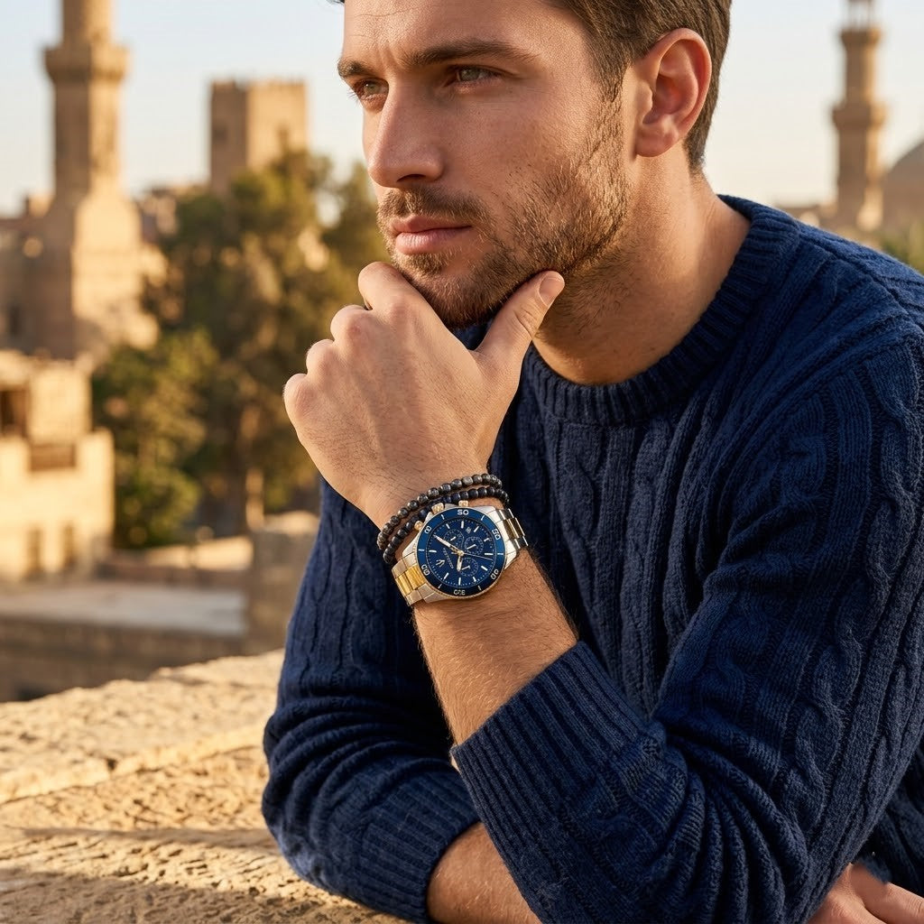 Elegant man wearing Maserati Competizione R8873600006 men's quartz battery watch with two-tone case and diver style blue dial