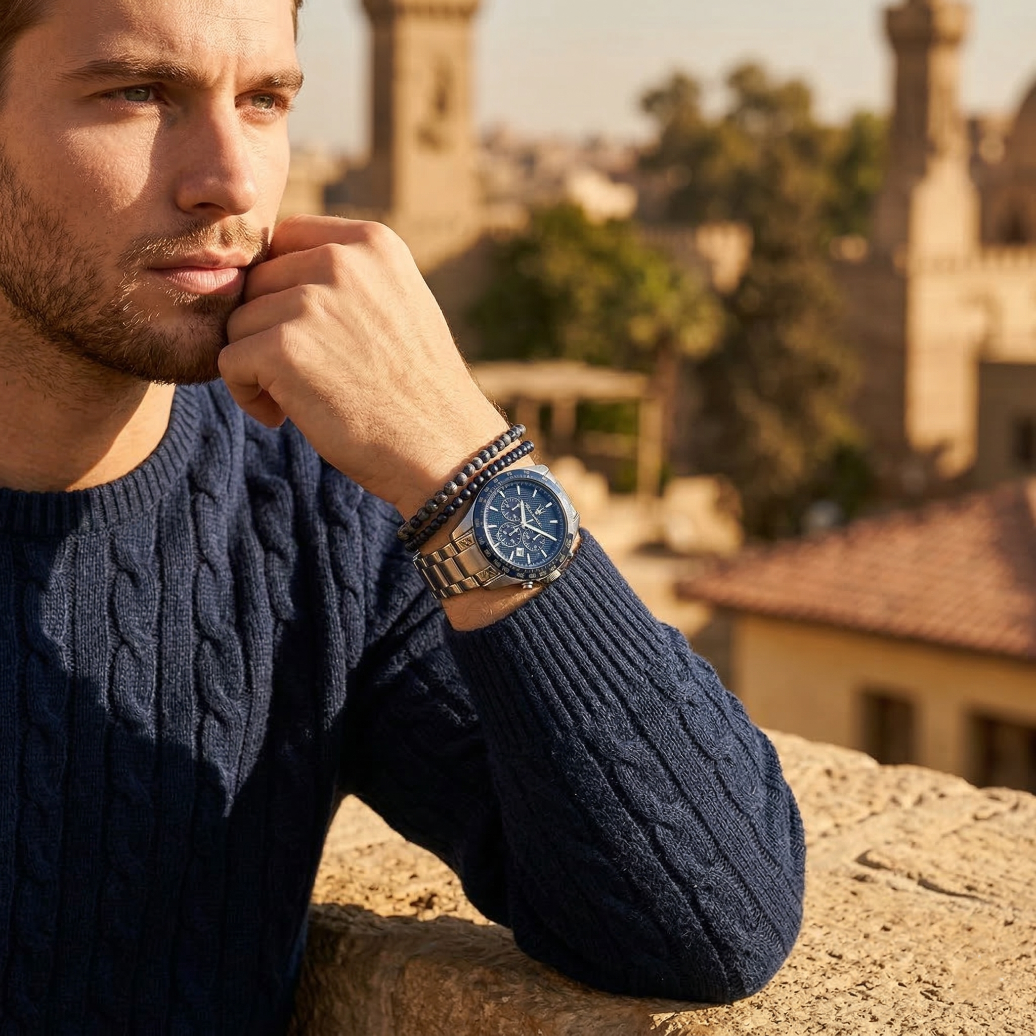 Elegant man wearing Maserati Traguardo R8873612043 men's quartz battery watch with silver-tone case and racing style blue dial