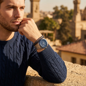 Elegant man wearing Maserati Traguardo R8873612043 men's quartz battery watch with silver-tone case and racing style blue dial
