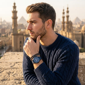 Elegant man wearing Maserati Epoca R8873618010 men's quartz battery watch with blue case and luxury blue dial