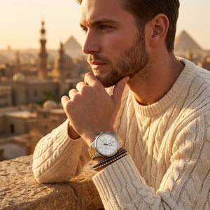 Elegant man wearing Maserati Sorpasso R8873624003 men's quartz battery watch with two-tone case and luxury white dial