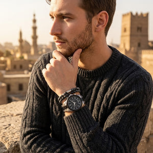 Elegant man wearing Maserati Circuito R8873627003 men's quartz battery watch with two-tone case and sporty black dial