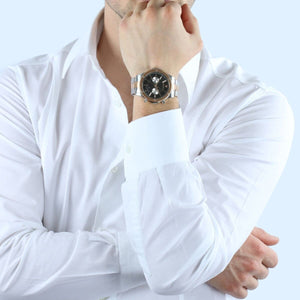 Elegant man wearing Maserati Circuito R8873627004 men's quartz battery watch with two-tone rose gold case and luxury black dial