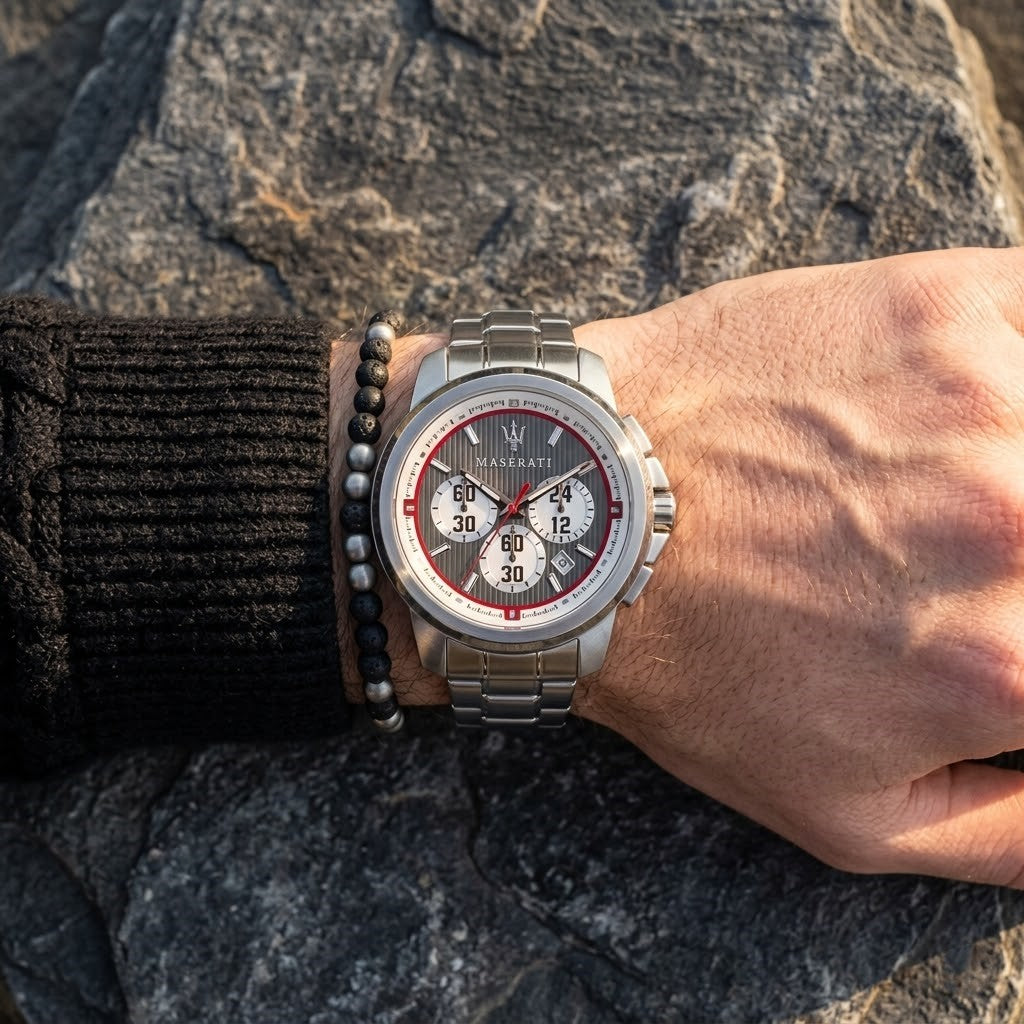 Close up of Maserati Royale R8873637003 men's quartz battery watch on wrist showing gray striped racing dial and silver case