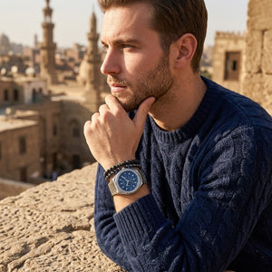 Elegant man wearing Maserati Triconic R8873639001 men's quartz battery watch with silver-tone case and luxury blue dial
