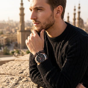 Elegant man wearing Maserati Triconic R8873639002 men's quartz battery watch with silver-tone case and racing style dial