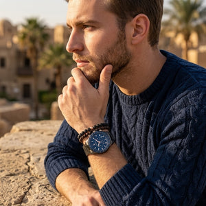Elegant man wearing Maserati Sfida R8873640001 men's quartz battery watch with gunmetal case and luxury blue dial