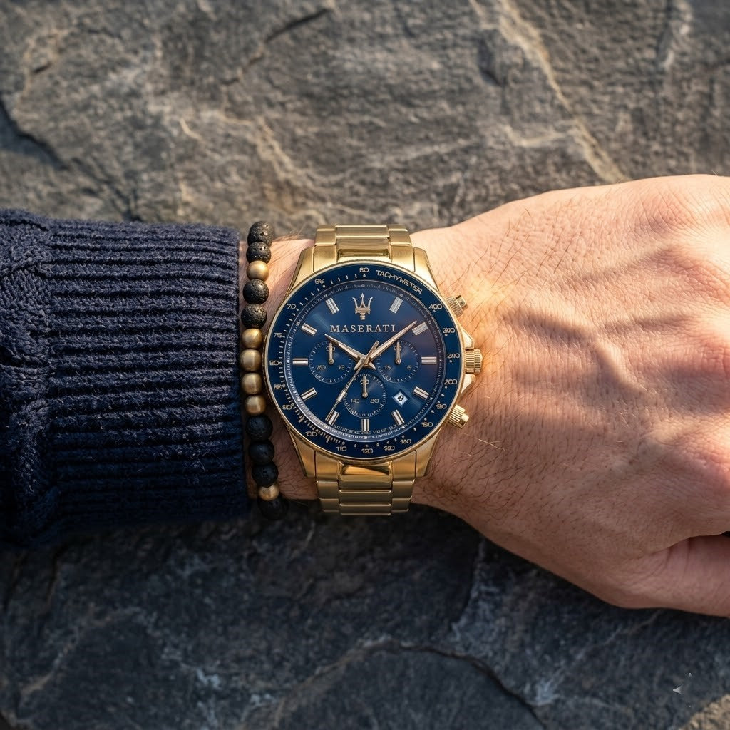 Close up of Maserati Sfida R8873640008 men's quartz battery watch on wrist showing blue racing dial and luxury gold case