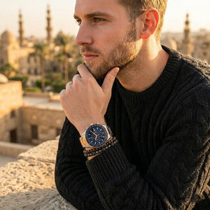 Elegant man wearing Maserati Sfida Chronograph R8873640012 men's quartz battery watch with two-tone case and luxury racing blue dial