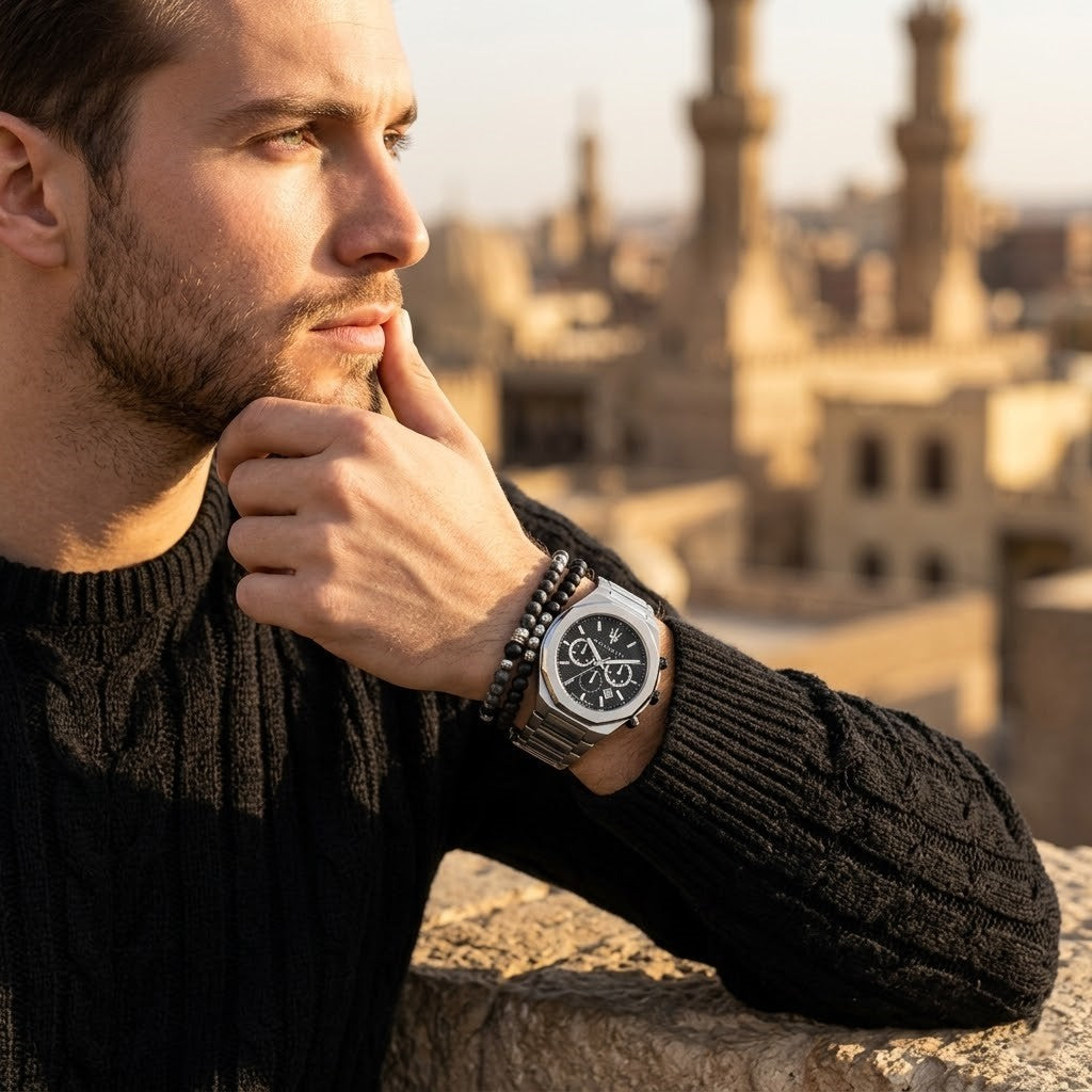 Elegant man wearing Maserati Stile R8873642004 men's quartz battery watch with silver-tone case and luxury textured dial
