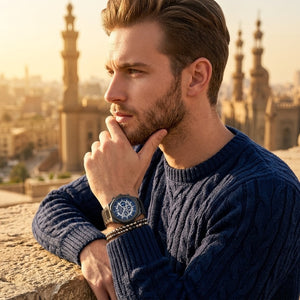 Elegant man wearing Maserati Stile R8873642012 men's quartz battery watch with gunmetal grey case and luxury skeleton dial