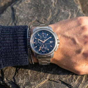 Close up of Maserati Successo Solar R8873645004 solar powered watch on wrist showing blue dial and rose gold-tone markers