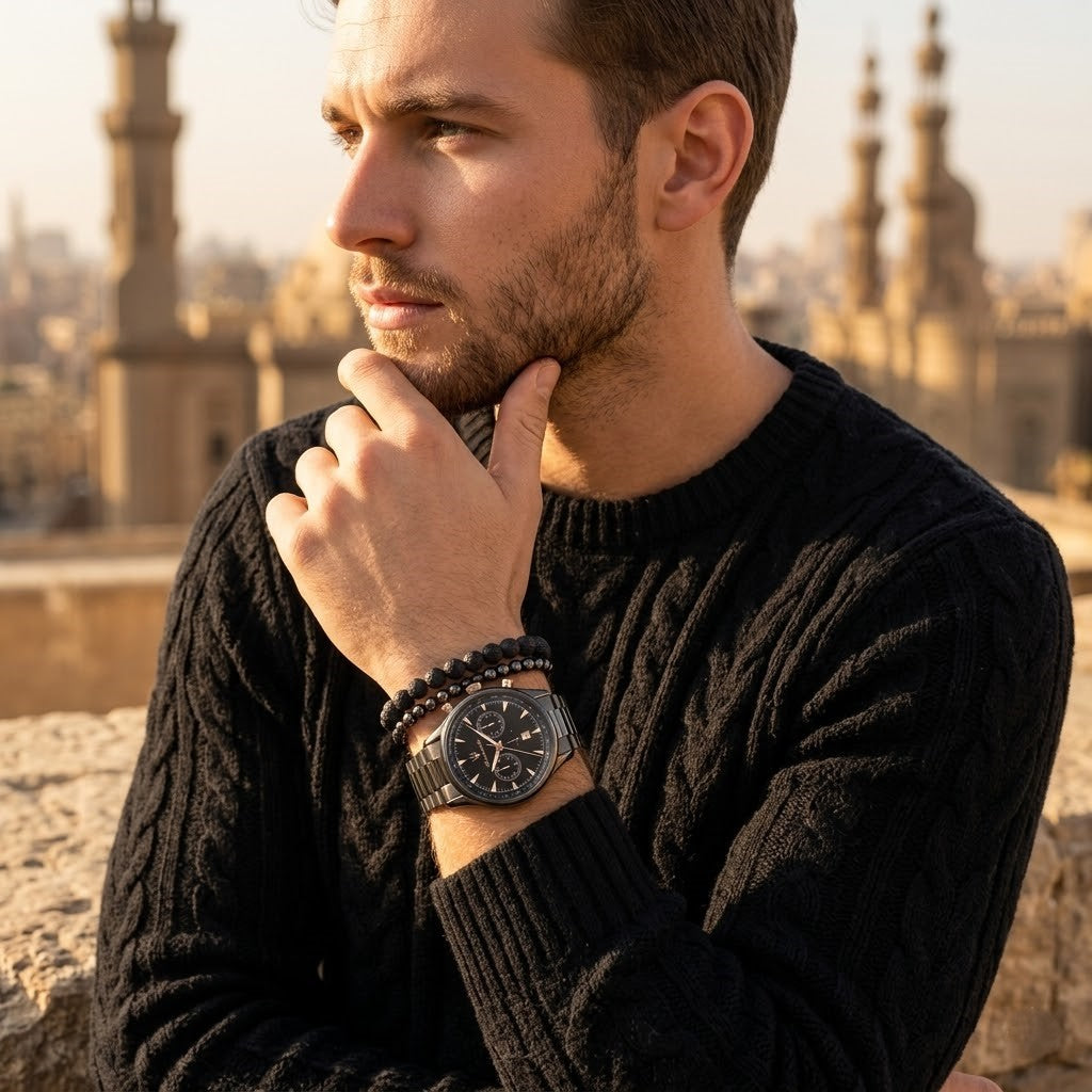 Elegant man wearing Maserati Traguardo R8873646001 men's quartz battery watch with gunmetal grey case and luxury black dial