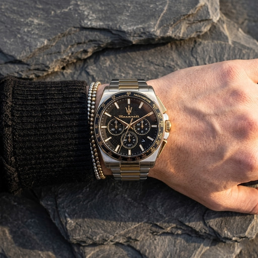 Close up of Maserati Velocita R8873652003 men's quartz battery watch on wrist showing black textured dial and two-tone metal bracelet