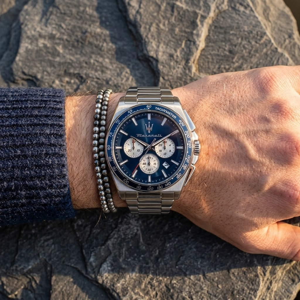 Close up of Maserati Velocita R8873652005 men's quartz battery watch on wrist showing blue panda chronograph dial and silver metal bracelet