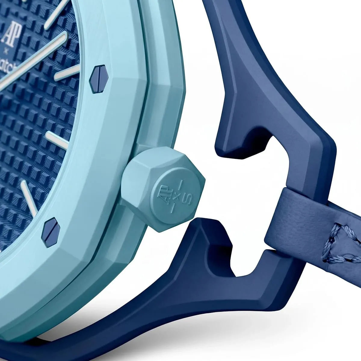 Close-up of a blue watch with a textured face and strap on a white background