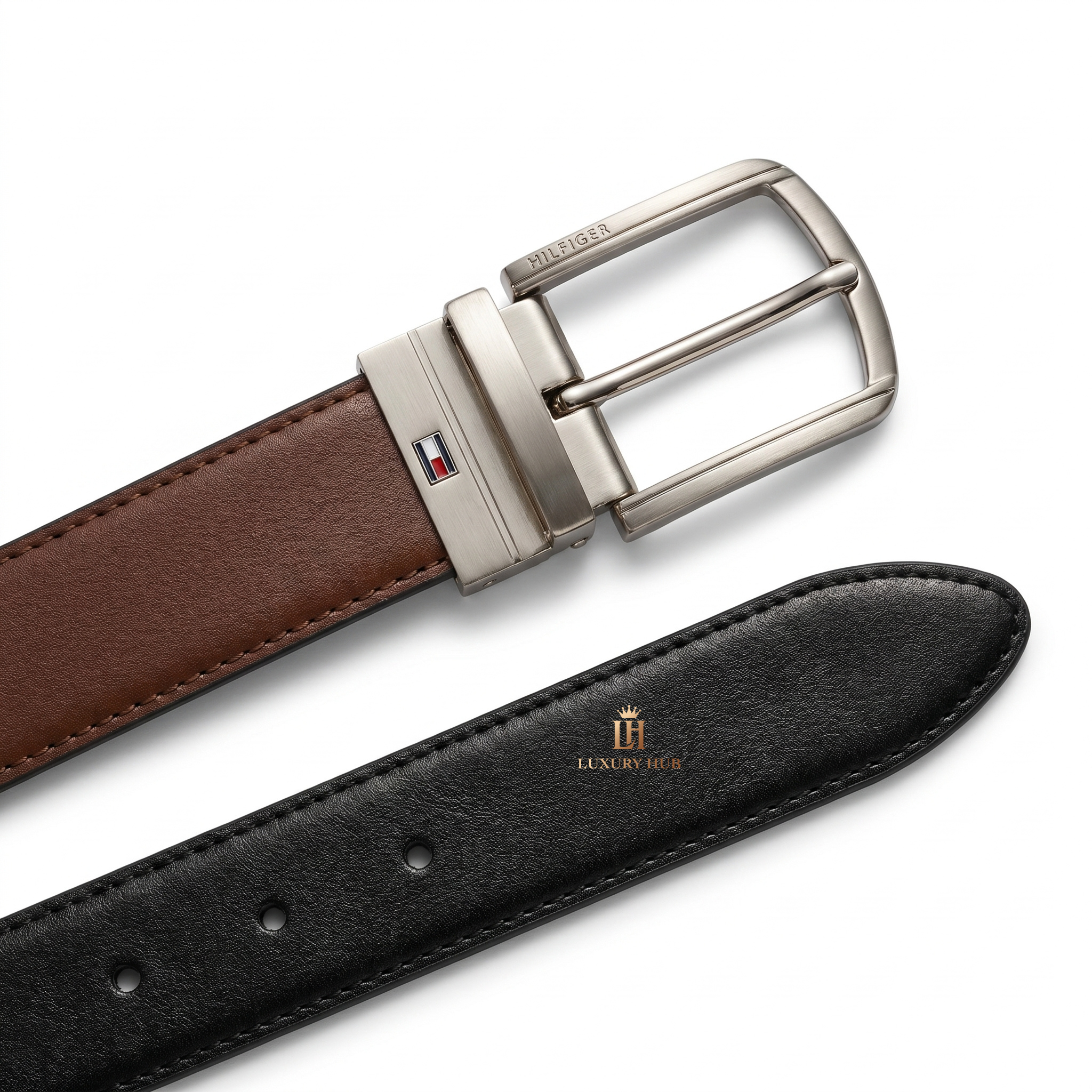 Detailed view of the Tommy Hilfiger double-face belt showing the reversible black and brown smooth leather textures and stitching