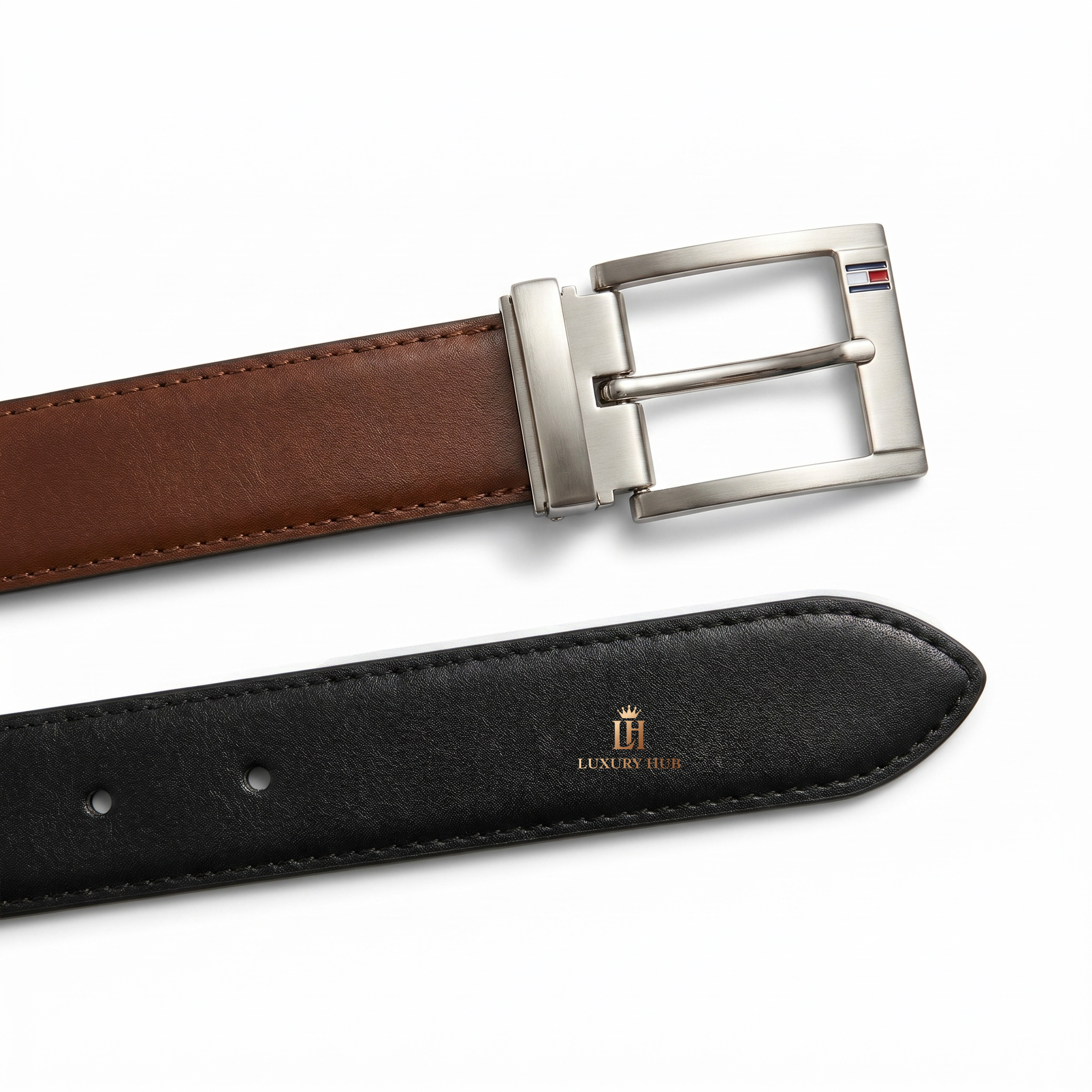 Detailed view of the Tommy Hilfiger double-face belt showing the reversible black and brown smooth leather textures and stitching