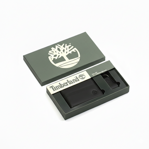 Timberland men's black leather wallet and keychain set elegantly displayed inside its original green branded gift box