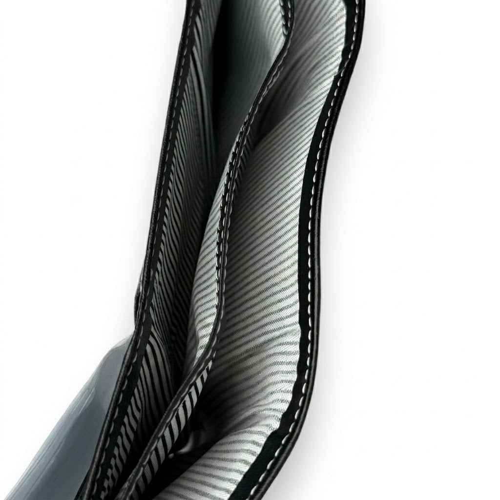 Live angled smartphone photograph showcasing the internal multi-card slots and cash pocket layout of the opened Timberland leather trifold wallet