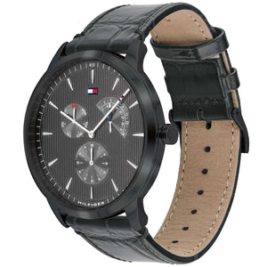 Angled view of Tommy Hilfiger 1710388 highlighting the matte black case finish and the crocodile leather texture