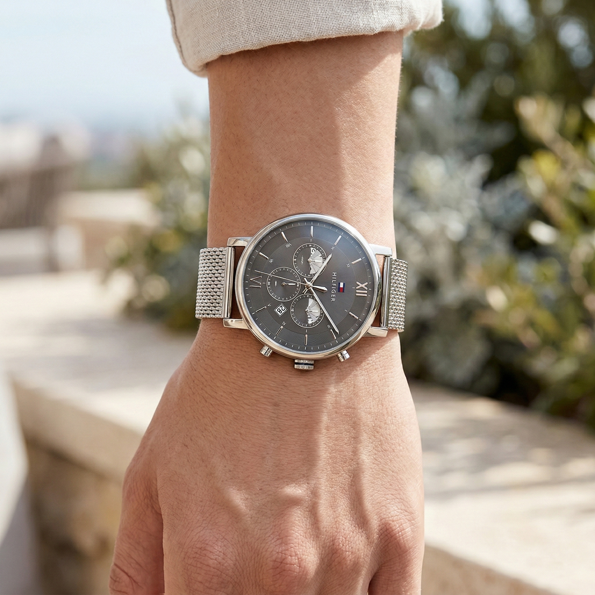 Close up shot of Tommy Hilfiger 1710396 on wrist showing the gunmetal gray dial and chronograph sub-dials