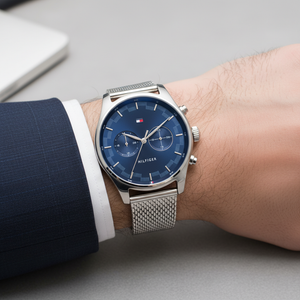 Close up shot of Tommy Hilfiger 1710420 watch on wrist showing the blue dual time dial