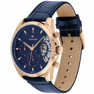 Angled view of Tommy Hilfiger 1710451 highlighting the polished gold-tone case and premium blue leather strap