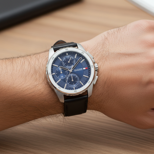 Close up shot of Tommy Hilfiger 1710619 on wrist showing the blue dial with multi-function sub-dials and silver hands