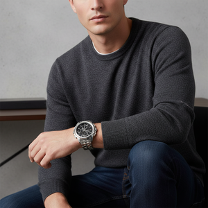 Male model wearing Tommy Hilfiger Walker 1710620 silver steel watch with a business suit