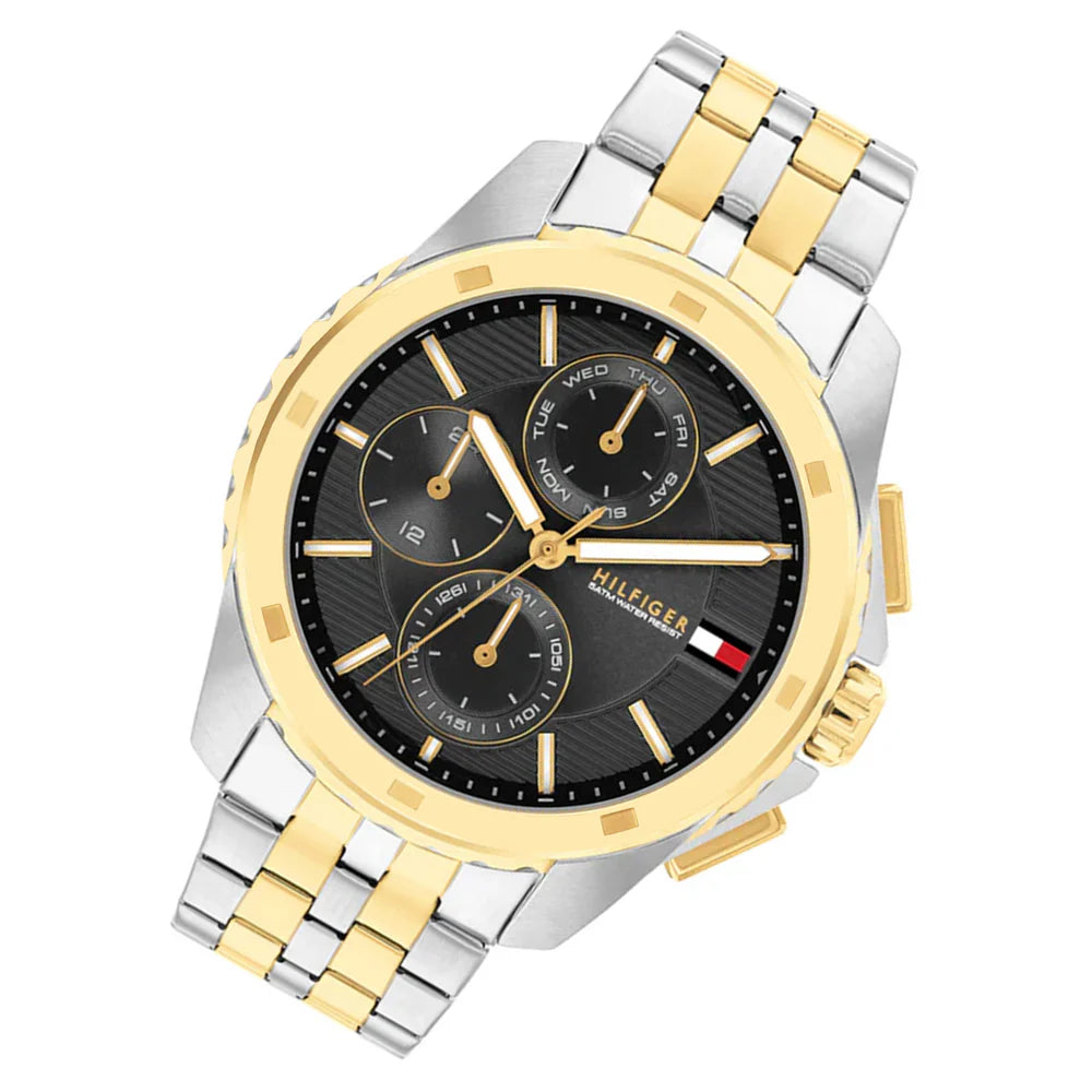 Angled view of Tommy Hilfiger 1710621 highlighting the polished silver and gold case and integrated bracelet