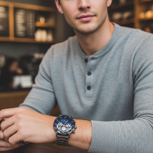 Male model wearing Tommy Hilfiger 1710707 gunmetal navy skeleton watch with a dark premium suit