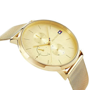 Side profile view showing the slim 8.5mm case thickness and polished gold finish of the Tommy Hilfiger watch