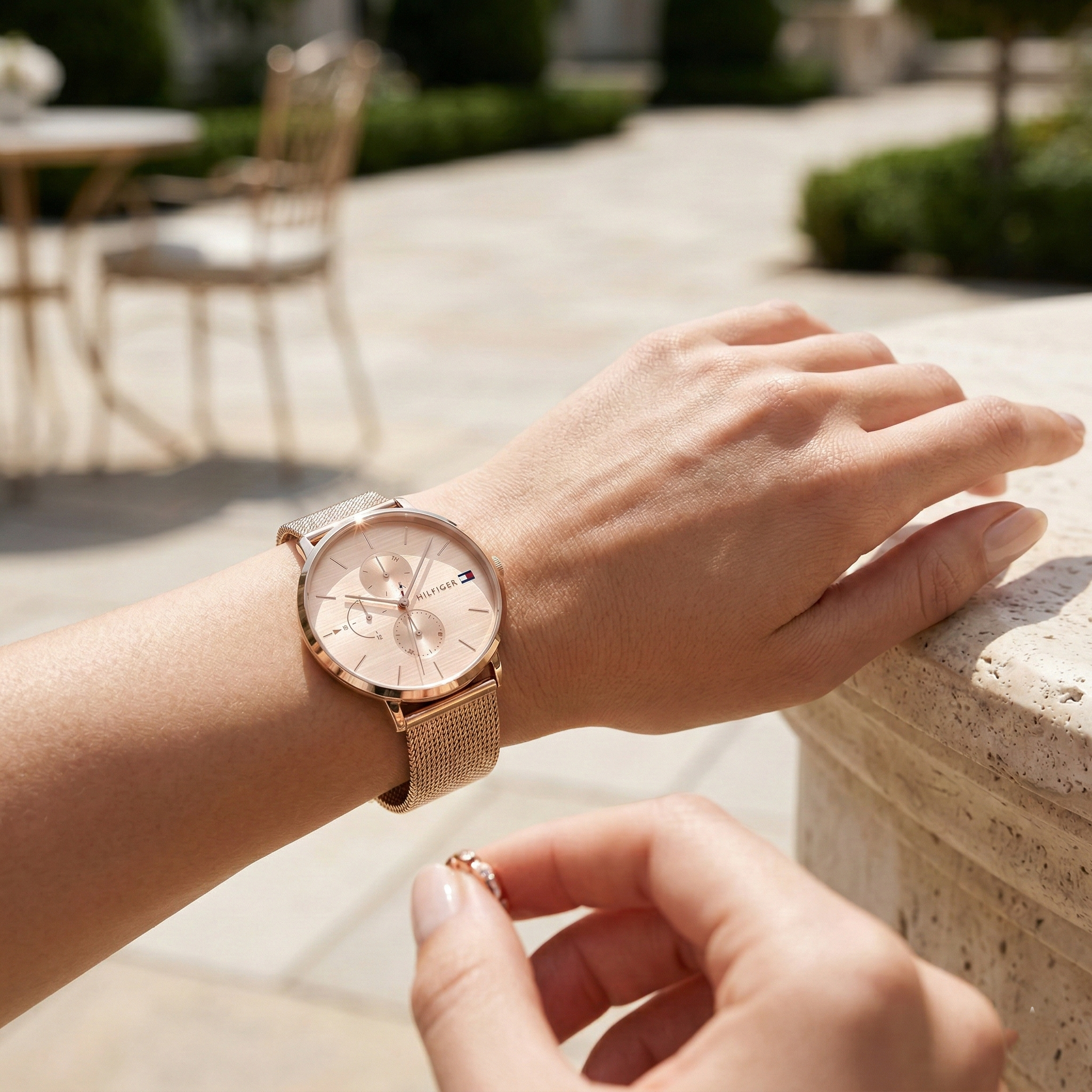 Close up shot of Tommy Hilfiger 1781944 on wrist showing the rose gold sunray dial and multi-function sub-dials