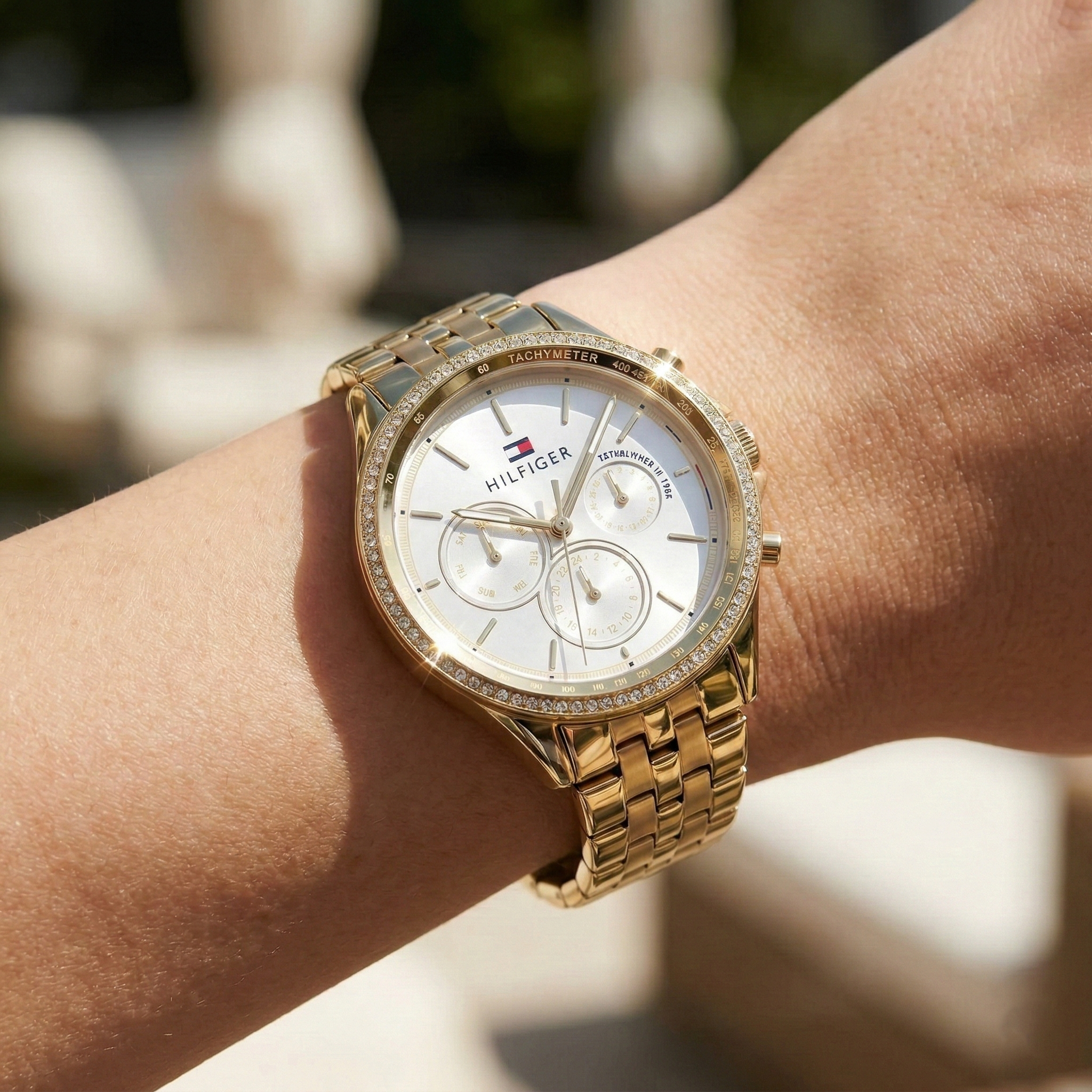 Close up shot of Tommy Hilfiger 1781977 on wrist showing the off-white dial and sparkling crystal bezel details