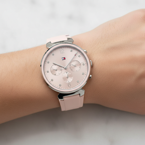 Detailed macro view of the pink sunray dial and crystal markers of Tommy Hilfiger 1782343