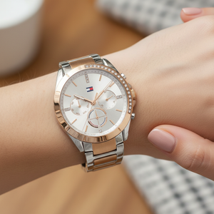 Close up shot of Tommy Hilfiger 1782387 watch on wrist showing the sparkling partial crystal bezel and silver dial