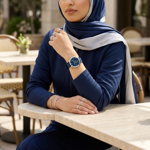 Woman wearing Tommy Hilfiger Kennedy navy blue rubber watch for a stylish sporty and casual look