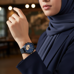Female model wearing Tommy Hilfiger 1782418 navy blue mesh watch with a stylish modern outfit