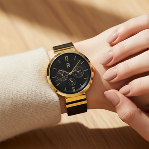 Close up shot of Tommy Hilfiger 1782540 watch on wrist showing the black sunray dial