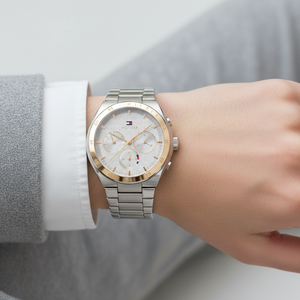Close up shot of Tommy Hilfiger 1782573 watch on wrist showing the textured silver dial and sub-dials