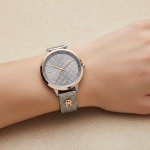 Close up shot of Tommy Hilfiger 1782587 watch on wrist showing the gray TH logo patterned dial