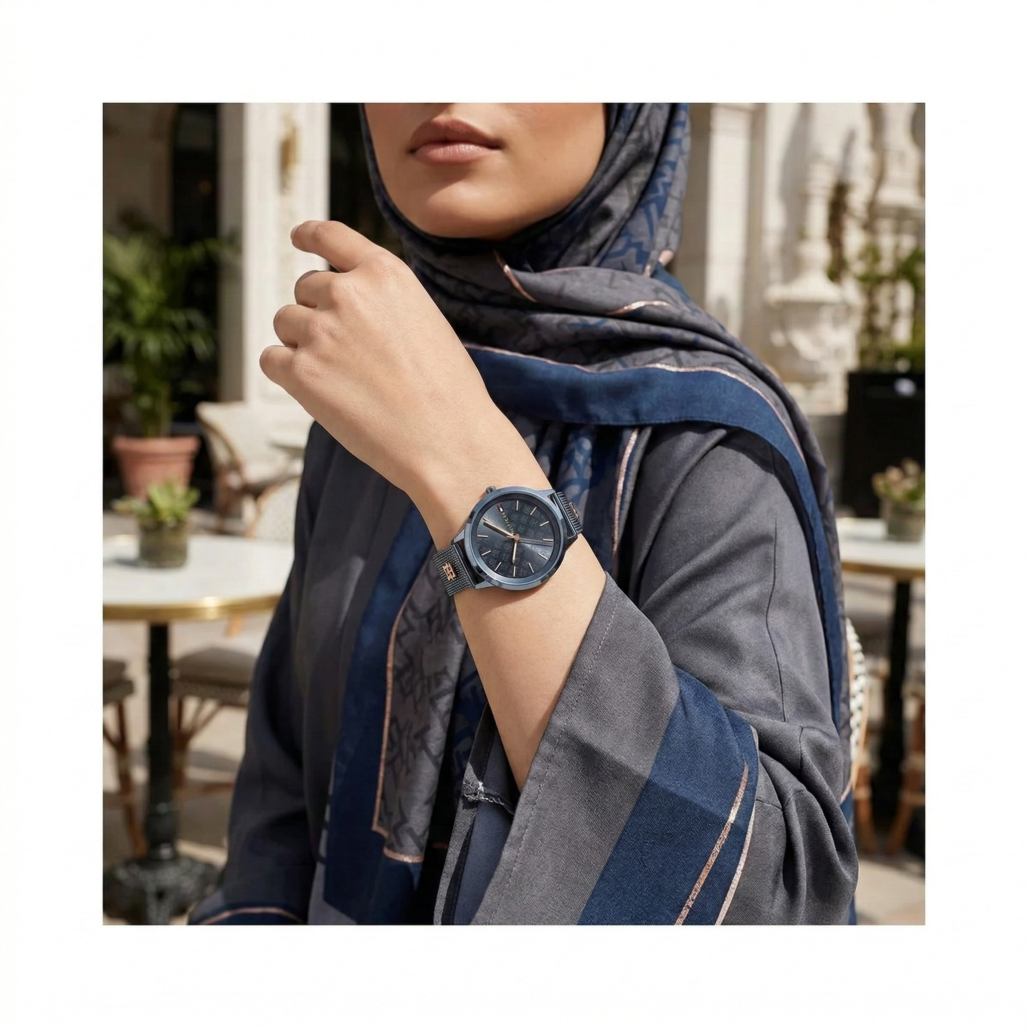 Woman wearing Tommy Hilfiger Iris slate blue mesh watch for a modern chic and sophisticated daily look