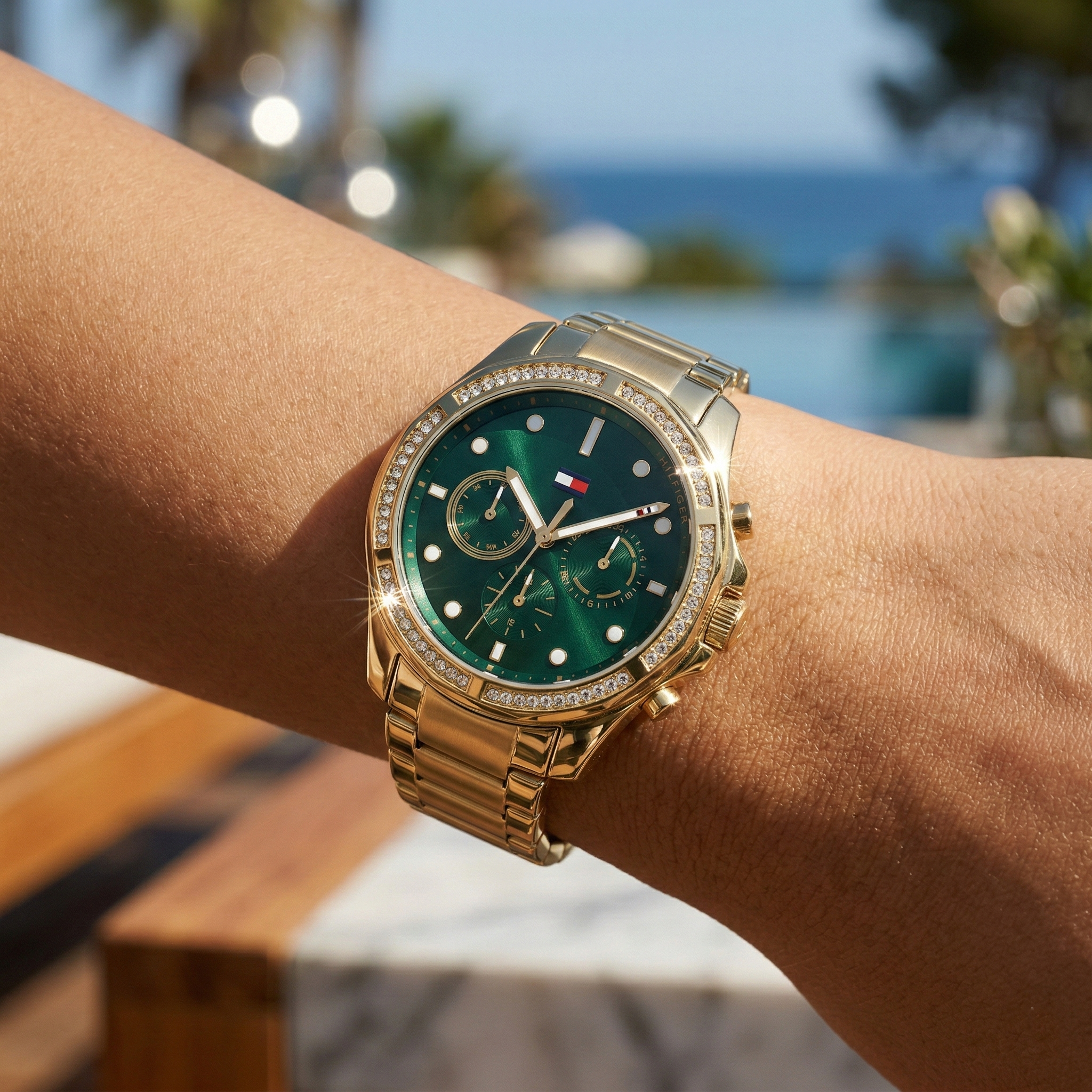 Close up shot of Tommy Hilfiger 1782614 on wrist showing the dark green dial and sparkling crystal bezel details