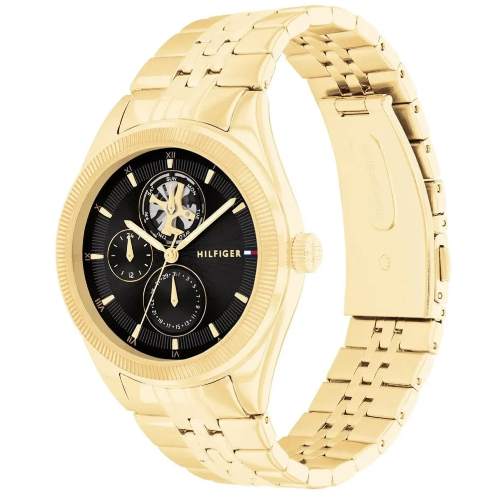 Angled view of the Tommy Hilfiger 1782717 highlighting the gold fluted bezel and crown