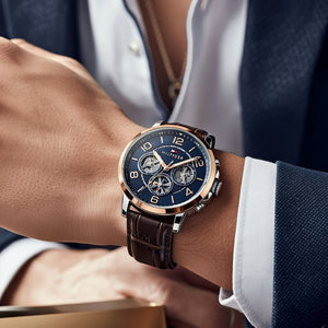 Male model wearing Tommy Hilfiger 1791290 rose gold watch with a smart casual outfit